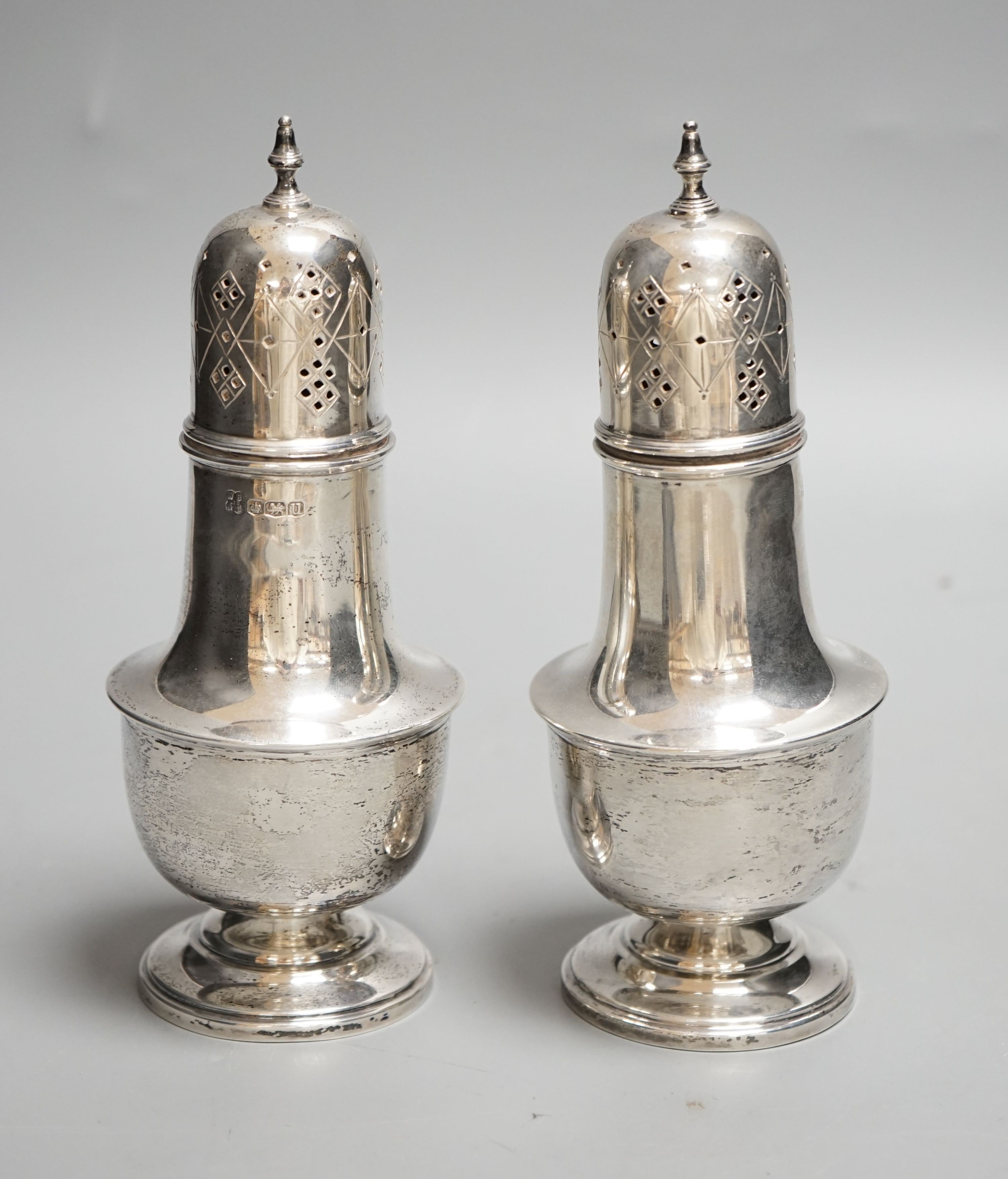 A pair of George VI silver sugar casters, William Batt & Sons, Sheffield, 1937, 17.7cm, 9oz.
